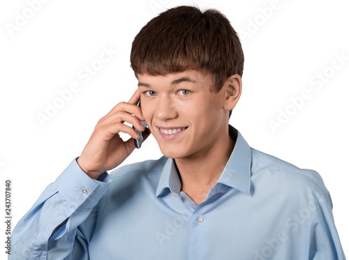 Young male businessman on cell phone