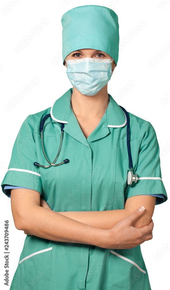 Female medical professional wearing a surgical mask Female medical professional wearing a surgical mask