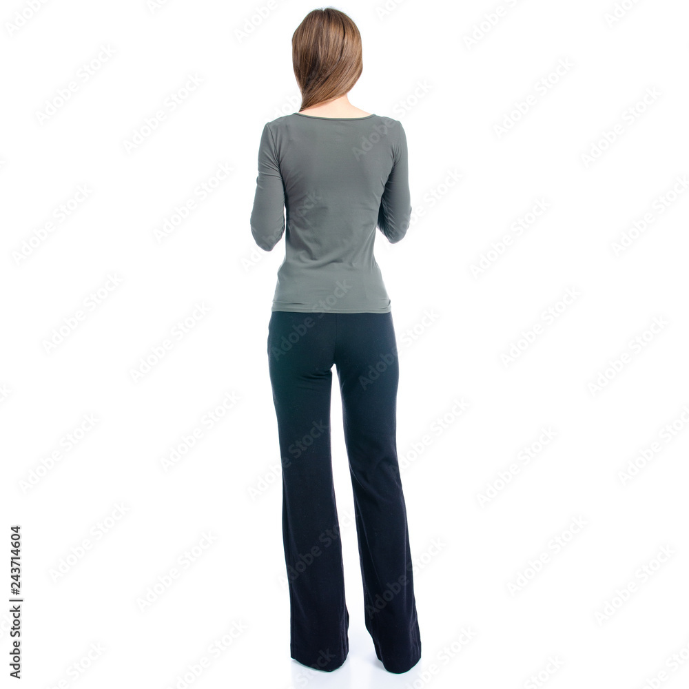 Woman in high heels shoes and black pants on white background isolation, back view Woman in high heels shoes and black pants on white background isolation, back view