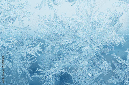Abstract frosty pattern on glass, background texture photo