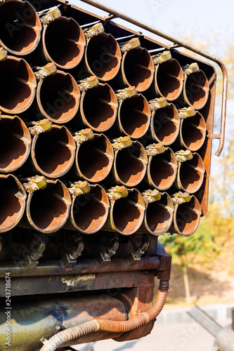 Missile firing system on military armored truck close up view. Rocket launcher closeup. photo