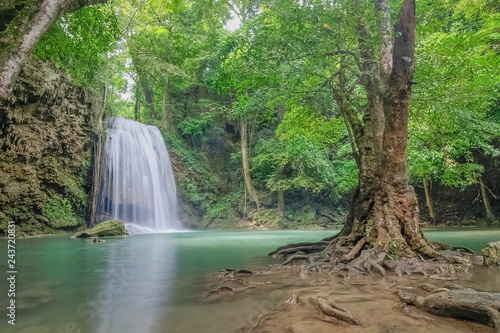 Erawan Waterfall  beautiful silky water flowing on arch rock around with green forest background  floor 3th Erawan waterfall  Kanchanaburi  Thailand.