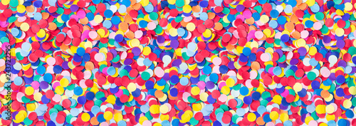 Colorful, round confetti as background for carnival, New Year's Eve, banner photo
