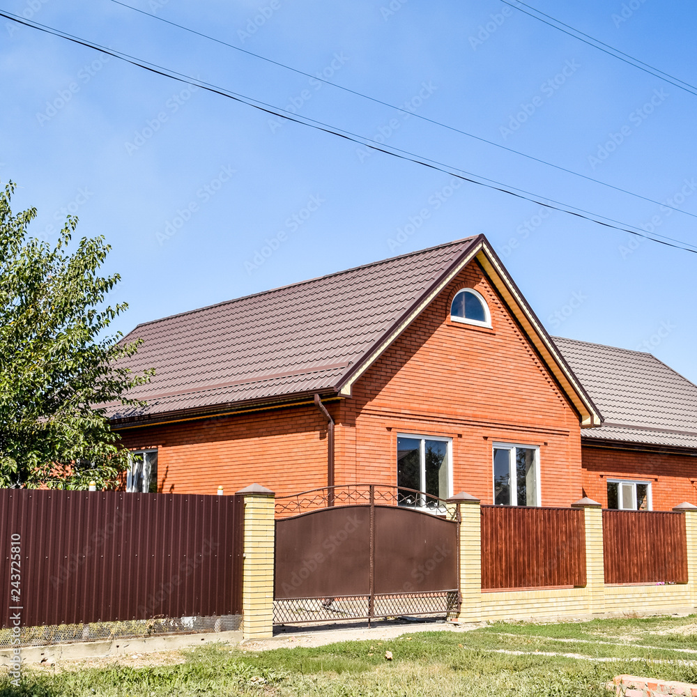 Detached house with a roof made of steel sheets. Detached house with a roof made of steel sheets.