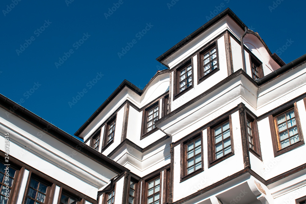 The Architecture of Ohrid. Part of a beautiful old-style house on the background of the blue sky in the Old Town. Macedonia