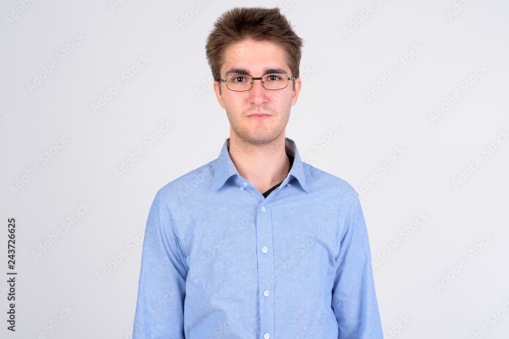 Young handsome businessman with eyeglasses looking at camera Young handsome businessman with eyeglasses looking at camera