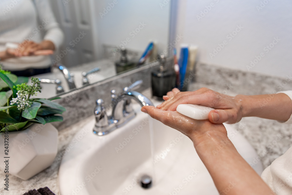 Stockfoto Young Caucasian Female Hands Lathering White Bar Hand Soap
