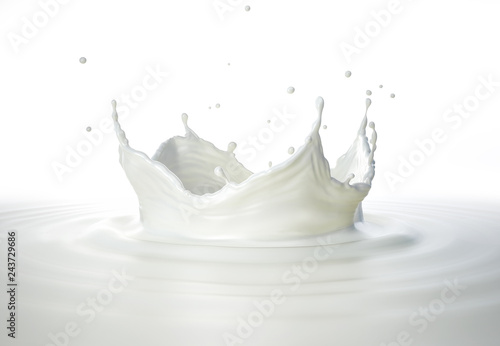 Milk crown splash, splashing in milk pool with ripples. Side view.