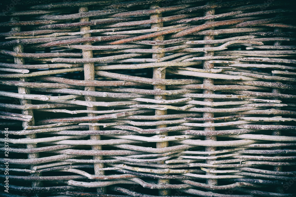 Textured surface of the fence of dried natural twigs Textured surface of the fence of dried natural twigs