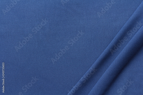 dark blue fabric with two large diagonal folds