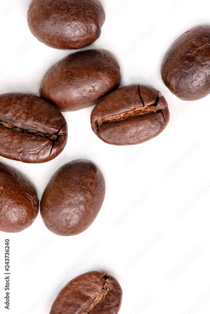 Macro of coffee beans on white background. Selective focus Macro of coffee beans on white background. Selective focus