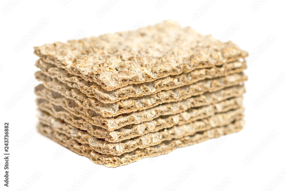 The healthy bread crisp with sesame isolated on white background The healthy bread crisp with sesame isolated on white background