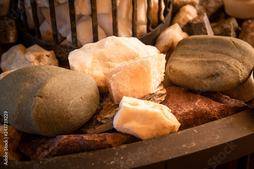 Hot sauna stones. Closeup photo of granite rocks, white, brown and gray