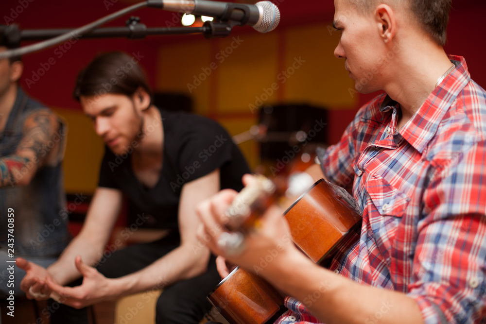 a rock band is working in studio. practice pause a rock band is working in studio. practice pause