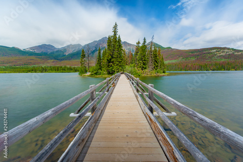 The Pyramid island in spring with color changing background in Alberta, Canada