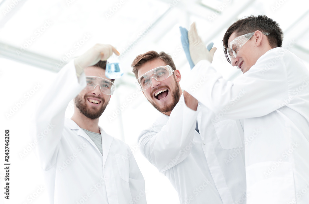 happy scientists look at the result of their work happy scientists look at the result of their work