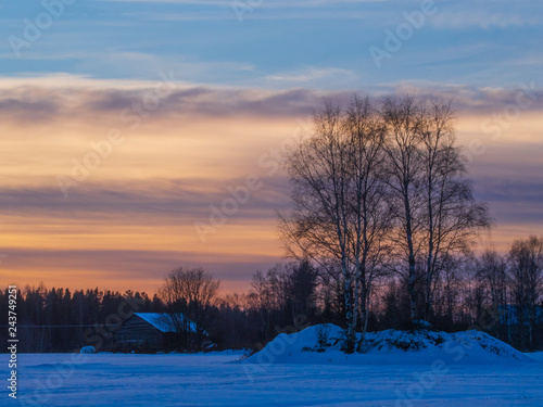 Winter sunset on the field photo