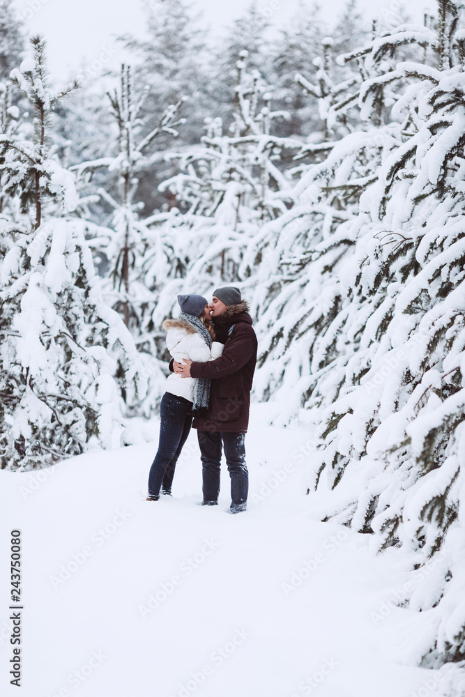 Young couple in love outdoor snowy winter Young couple in love outdoor snowy winter