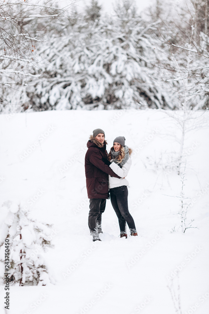 Young couple in love outdoor snowy winter Young couple in love outdoor snowy winter