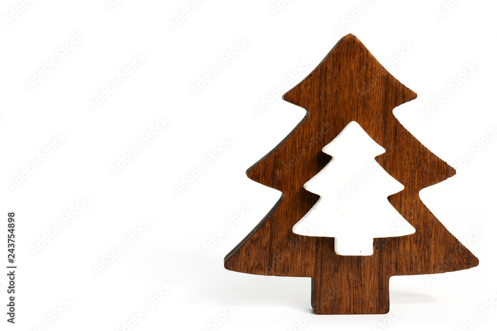 Tree shape cut out from wood as Christmas decoration with vintage look laid on white background Tree shape cut out from wood as Christmas decoration with vintage look laid on white background