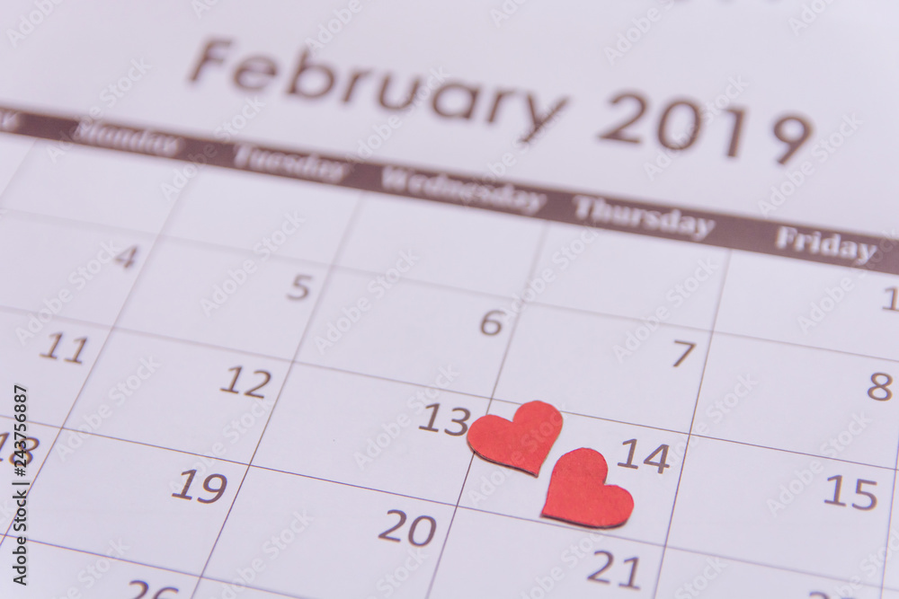 Valentines day greeting card. Red hearts paper on Calendar page February 14 with copy space Valentines day greeting card. Red hearts paper on Calendar page February 14 with copy space