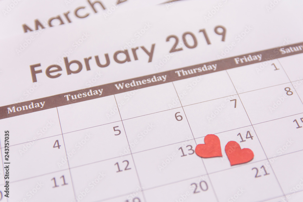 Valentines day greeting card. Red hearts paper on Calendar page February 14 with copy space Valentines day greeting card. Red hearts paper on Calendar page February 14 with copy space