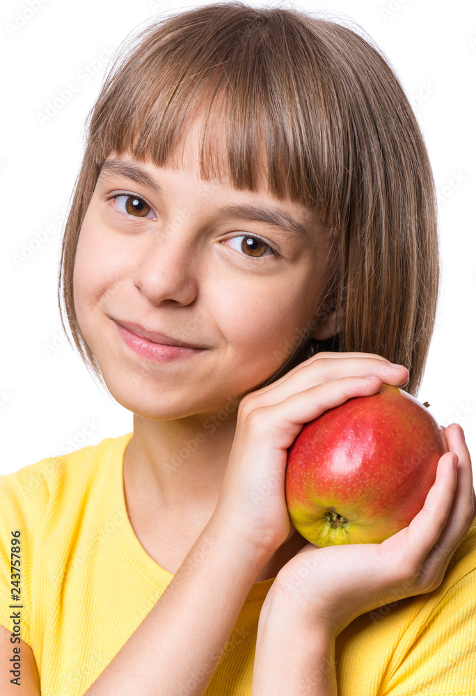 Attractive caucasian Girl with Apple, isolated on white background. Schoolgirl Smiling and looking at camera. Happy Child with fresh Fruit - emotional Portrait close-up. Attractive caucasian Girl with Apple, isolated on white background. Schoolgirl Smiling and looking at camera. Happy Child with fresh Fruit - emotional Portrait close-up.