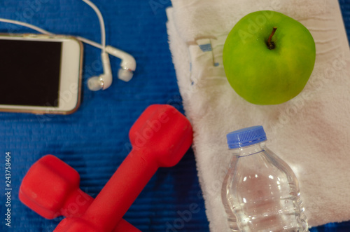 Fitness equipment on a blue background