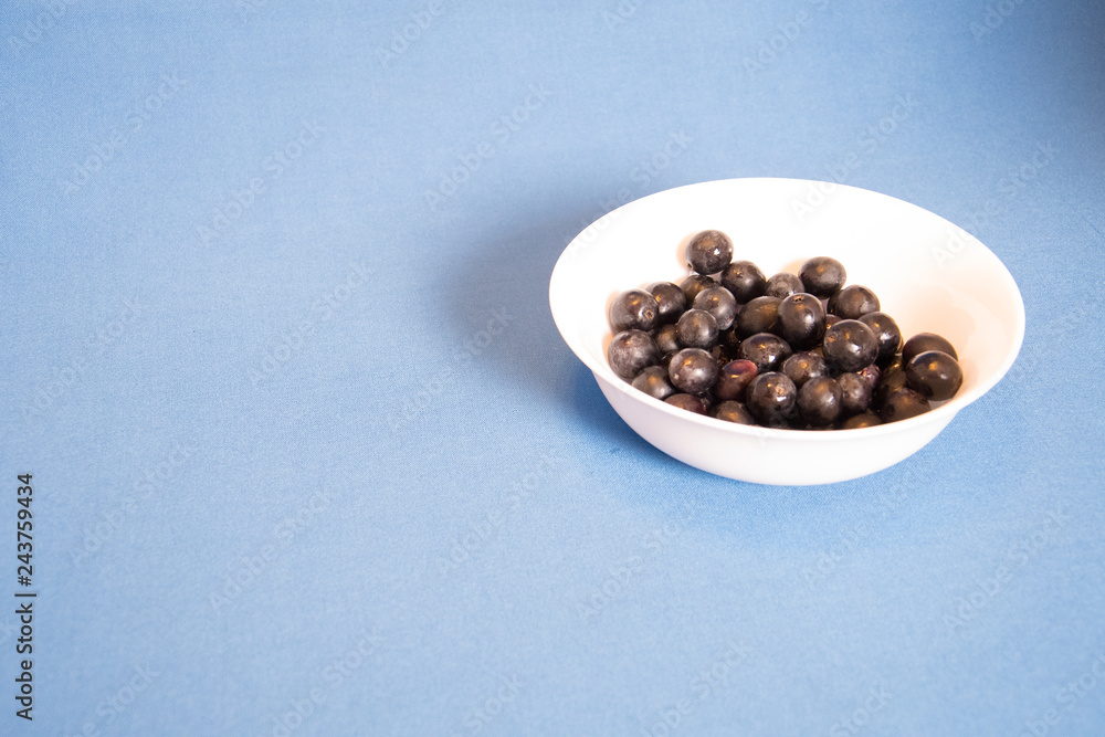 blue berry in a bowl on white background blue berry in a bowl on white background