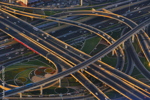 Night aerial dron view of highway interchange, birds eye, United Arab Emirates