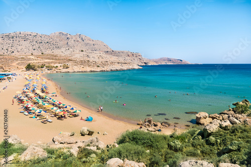 Agathi beach with holiday makers enjoying their time (Rhodes, Greece)