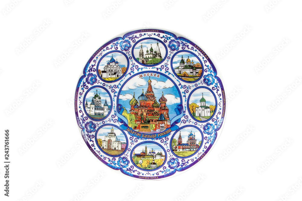 ceramic souvenir toy in the form of plate with color painting on isolated white background reflecting the national Russian culture with the inscription in Russian: The Golden ring of Russia Moscow