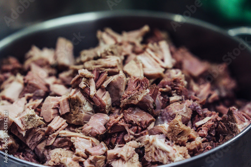 Freshly Boiled Pork in Stainless Steel Kettle on Table - Meal Preparation for Wedding, Kitchen Set © Reinholds