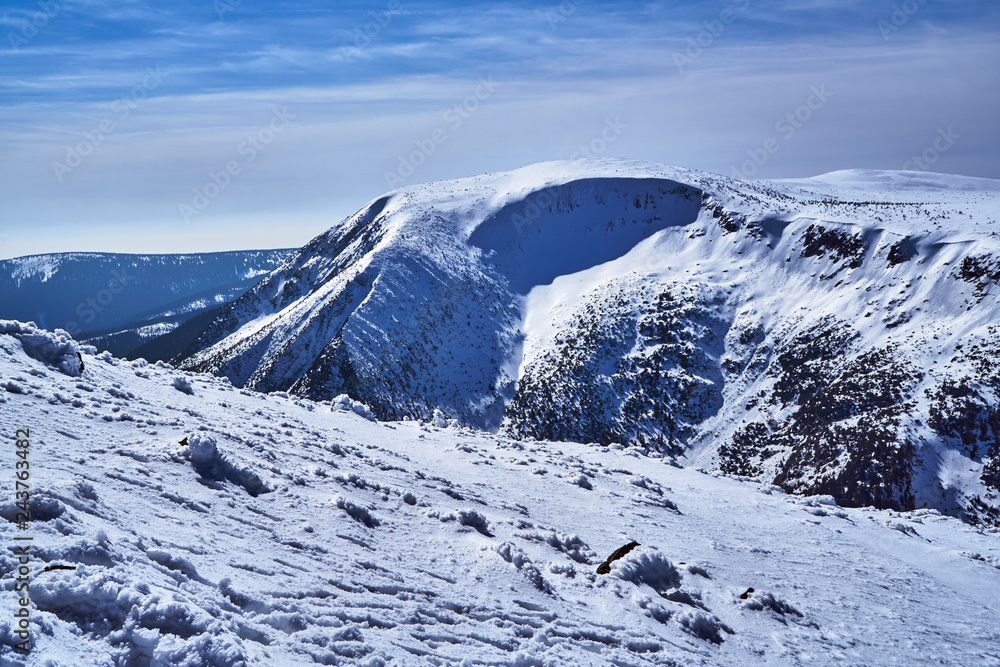 Overwhelmed snow rocky ridge in the Giant Mountains in Poland..