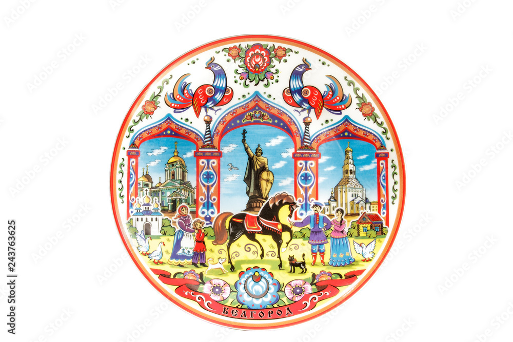 ceramic souvenir toy in the form of plate with color painting on isolated white background reflecting the national Russian culture with the inscription in Russian: the name of the city of Belgorod