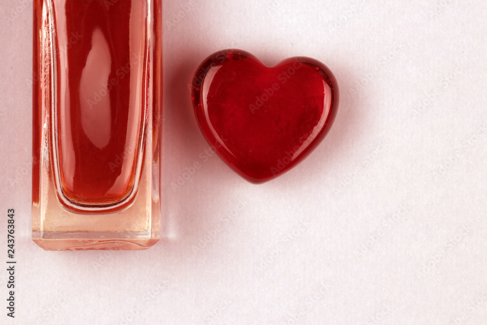 Set of parfume bottle and heart as a symbol of gift with love Set of parfume bottle and heart as a symbol of gift with love