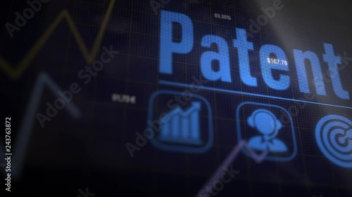 Patent business concept on a flashing computer monitor with moving graphs and data.