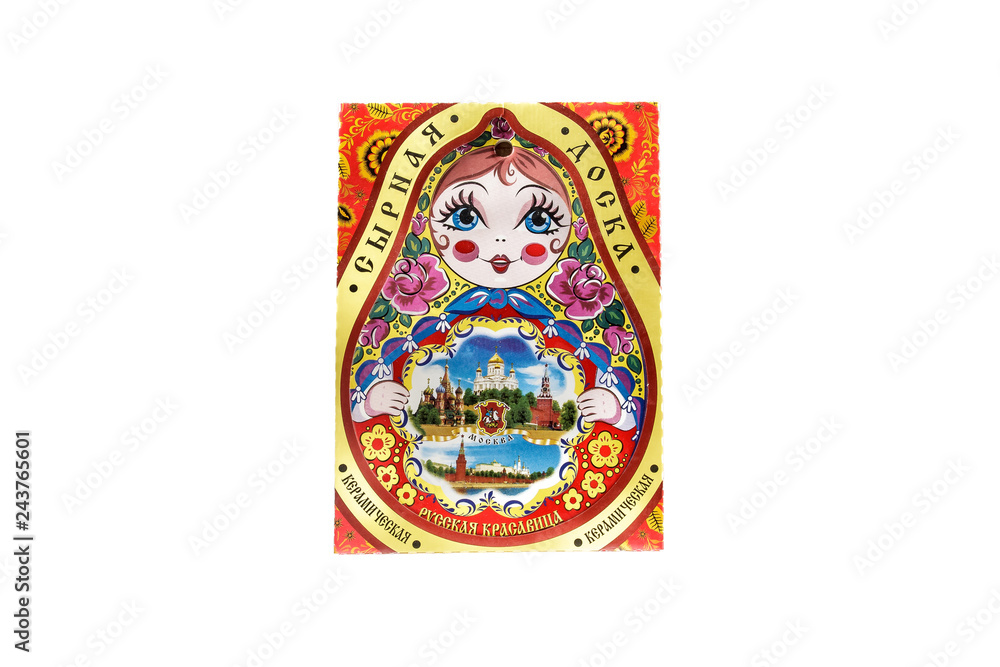 ceramic souvenir toy in the form of matryoshka with painting on isolated white background reflecting the national Russian culture with the inscription in Russian: Ceramic cheese board Russian beauty