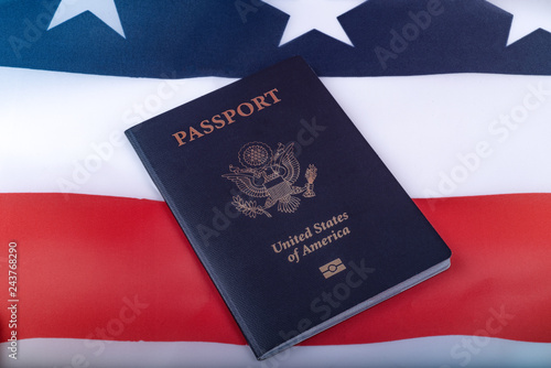 American Passport on Flag of USA surface. Close up view.