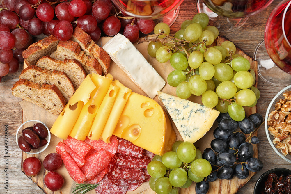 Flat lay composition with wine and snacks on wooden background Flat lay composition with wine and snacks on wooden background