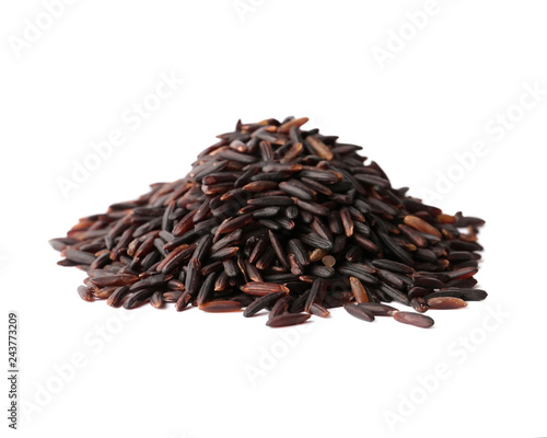 Pile of uncooked black rice on white background