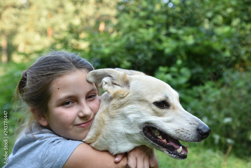 Girl hugging a dog