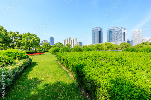 Modern city skyline and green garden in shanghai © ABCDstock