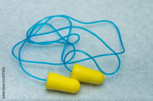   yellow  ear plugs isolated