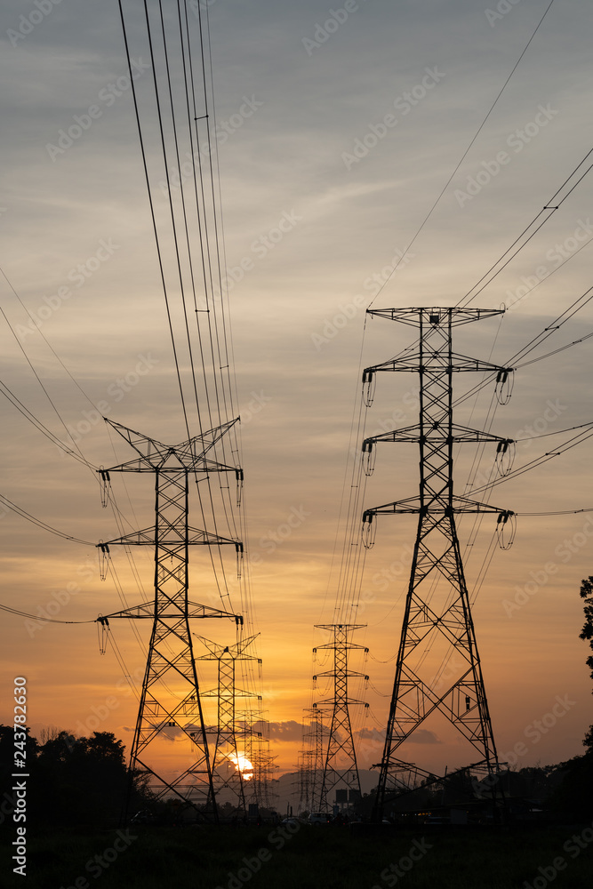 electricity pylons at sunset