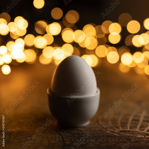 Egg standing on egg cup.