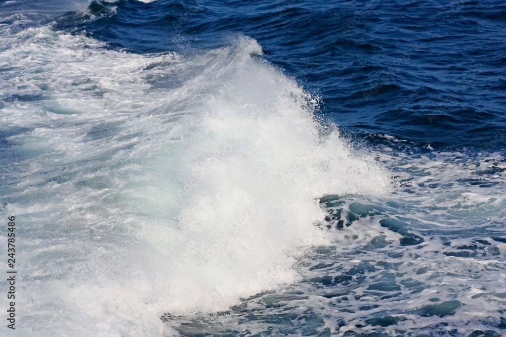 Small blue sea wave. Nature background. Beautiful natural composition. Wave as a background. 