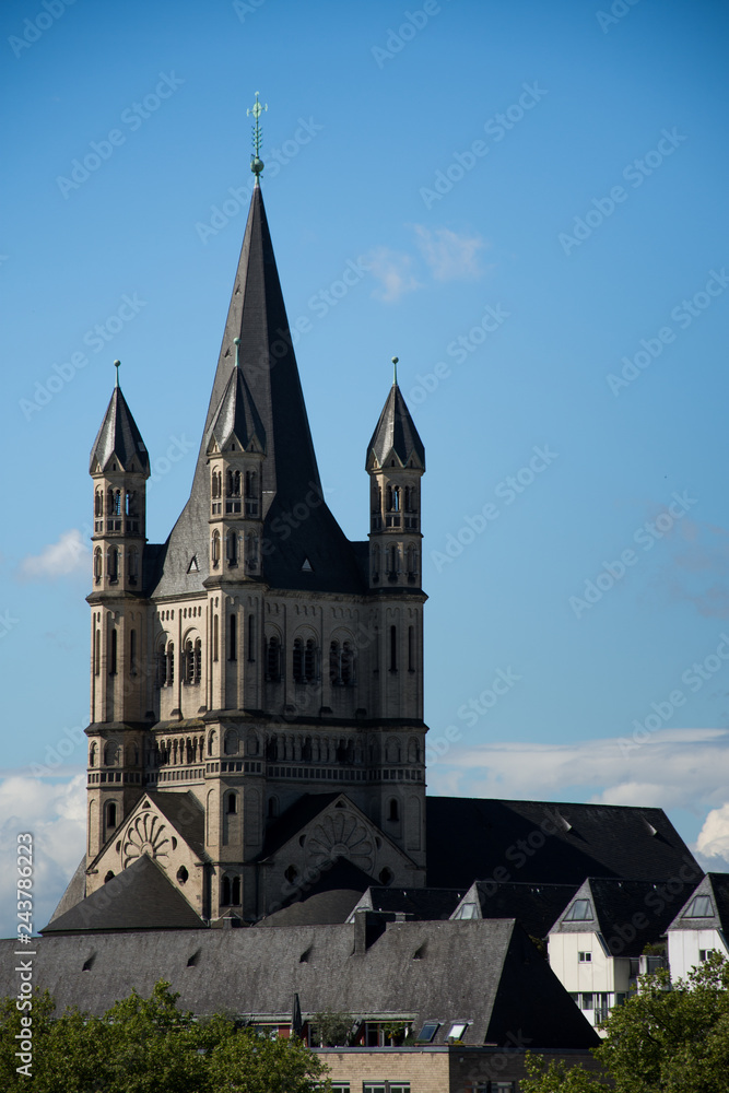 Fototapeta premium Great St. Martin Church and colorful houses in Cologne, Germany,may ,2017