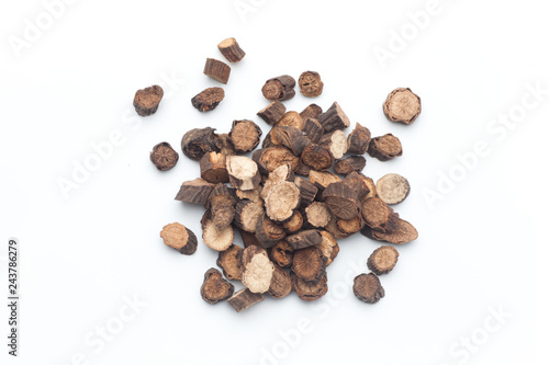 Sliced ​​of Red peony roots on white background. Chinese herbal medicine.