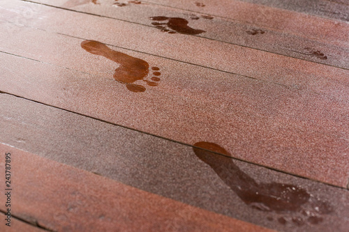 Fotografi Footprints on dusty wooden floor